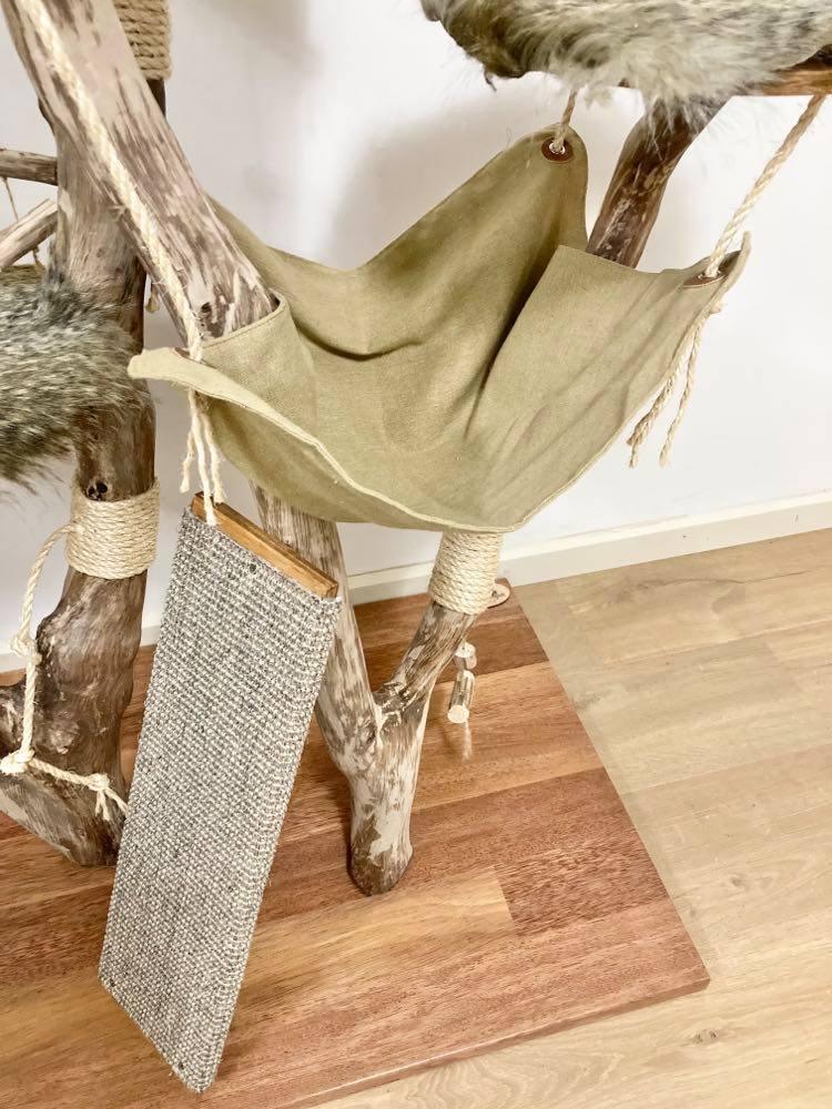 Photo of Play cat tree. Cat scratcher. Kitty climber. Close up of cat scratcher and hammock